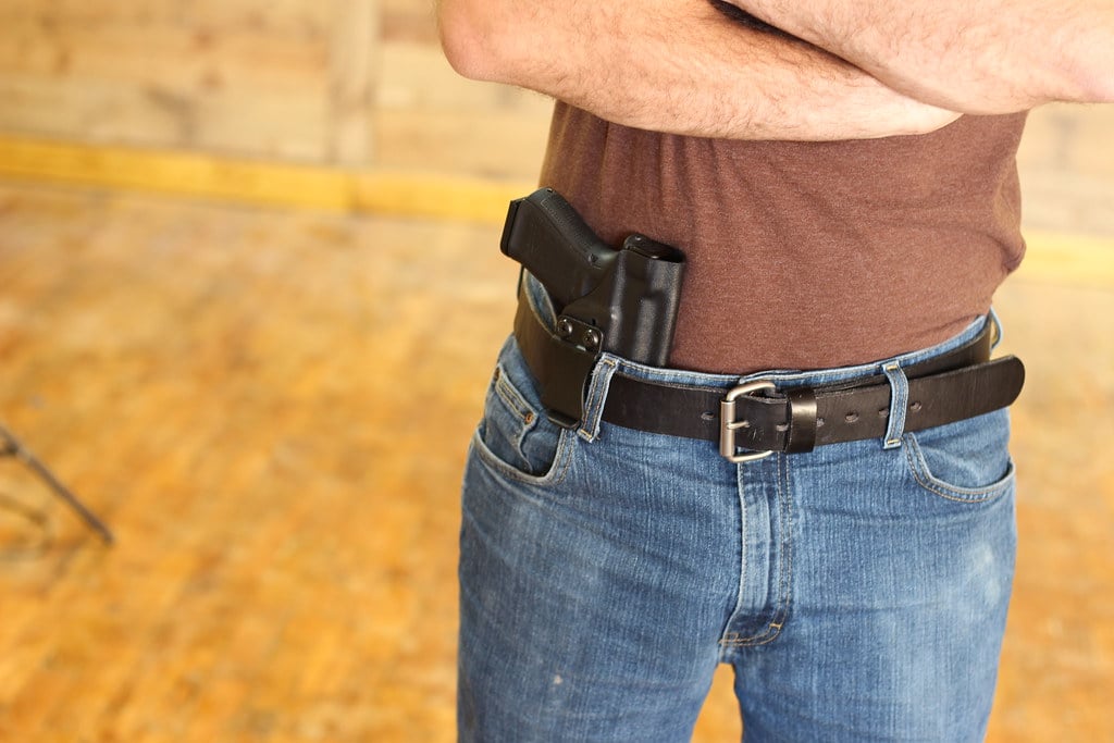 Man with appendix concealed carry holster